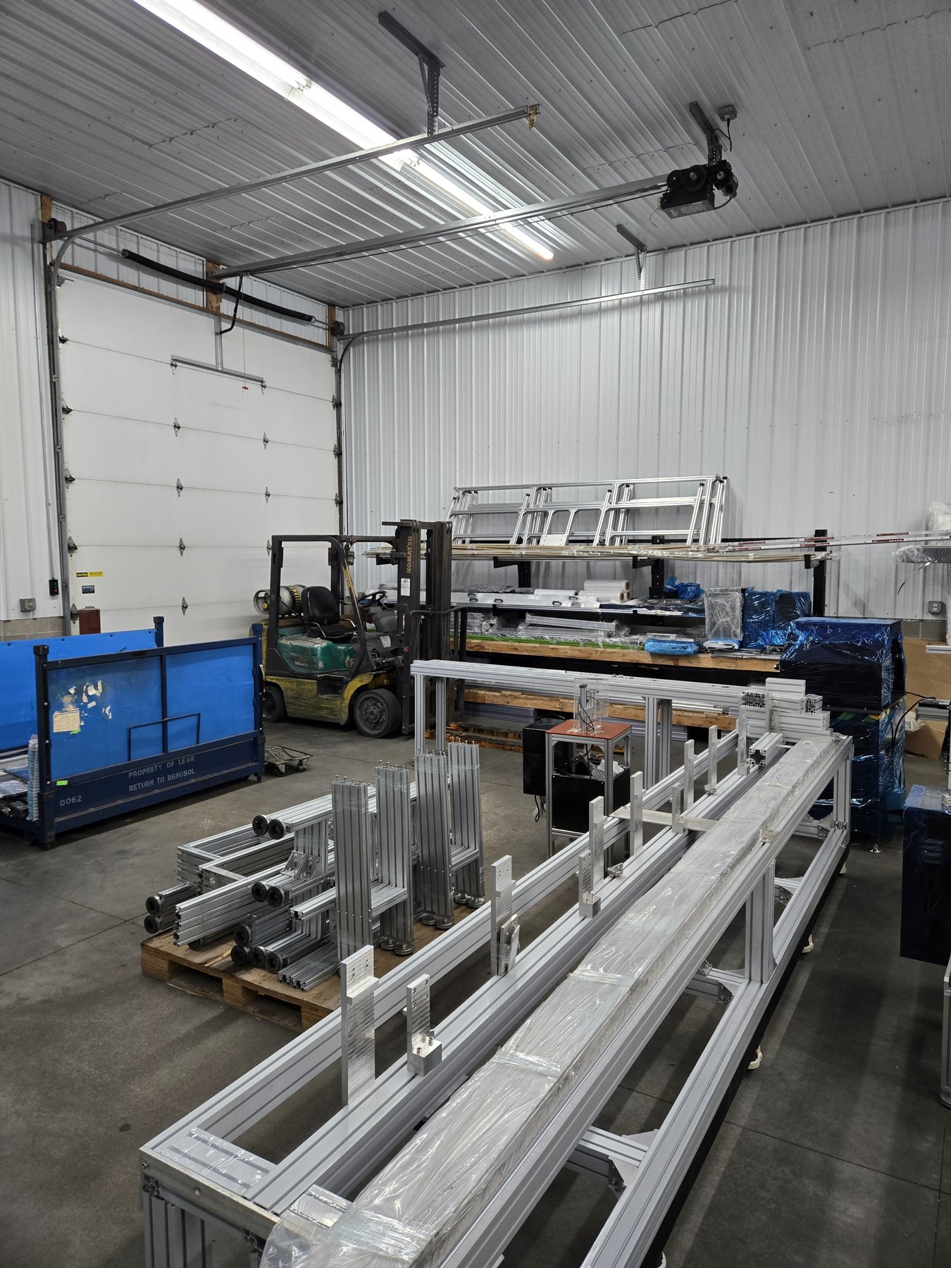Aluminum extrusion stock and forklift in the warehouse